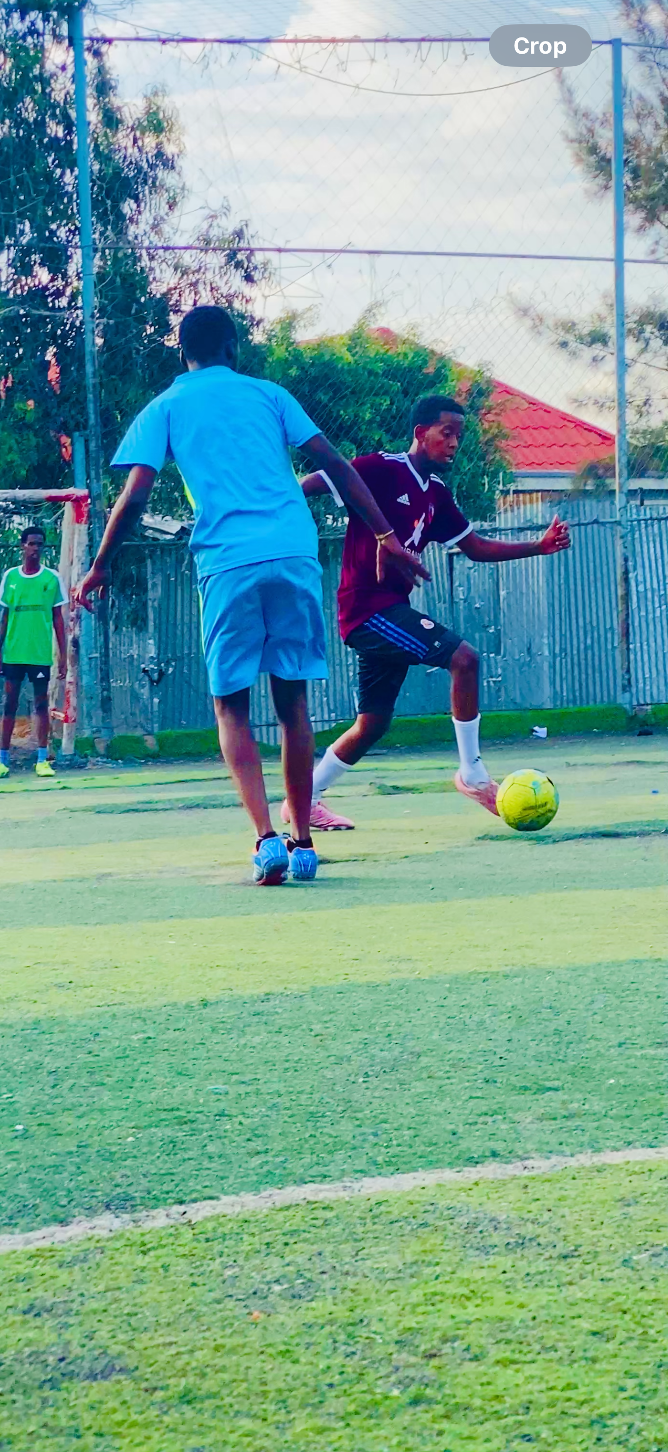 Hamze playing soccer on the field